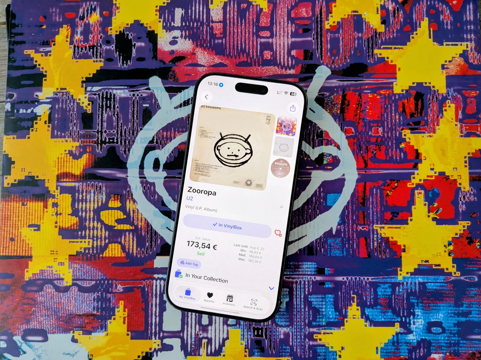 VinylBox displaying Zooropa on a phone resting on the U2 record sleeve