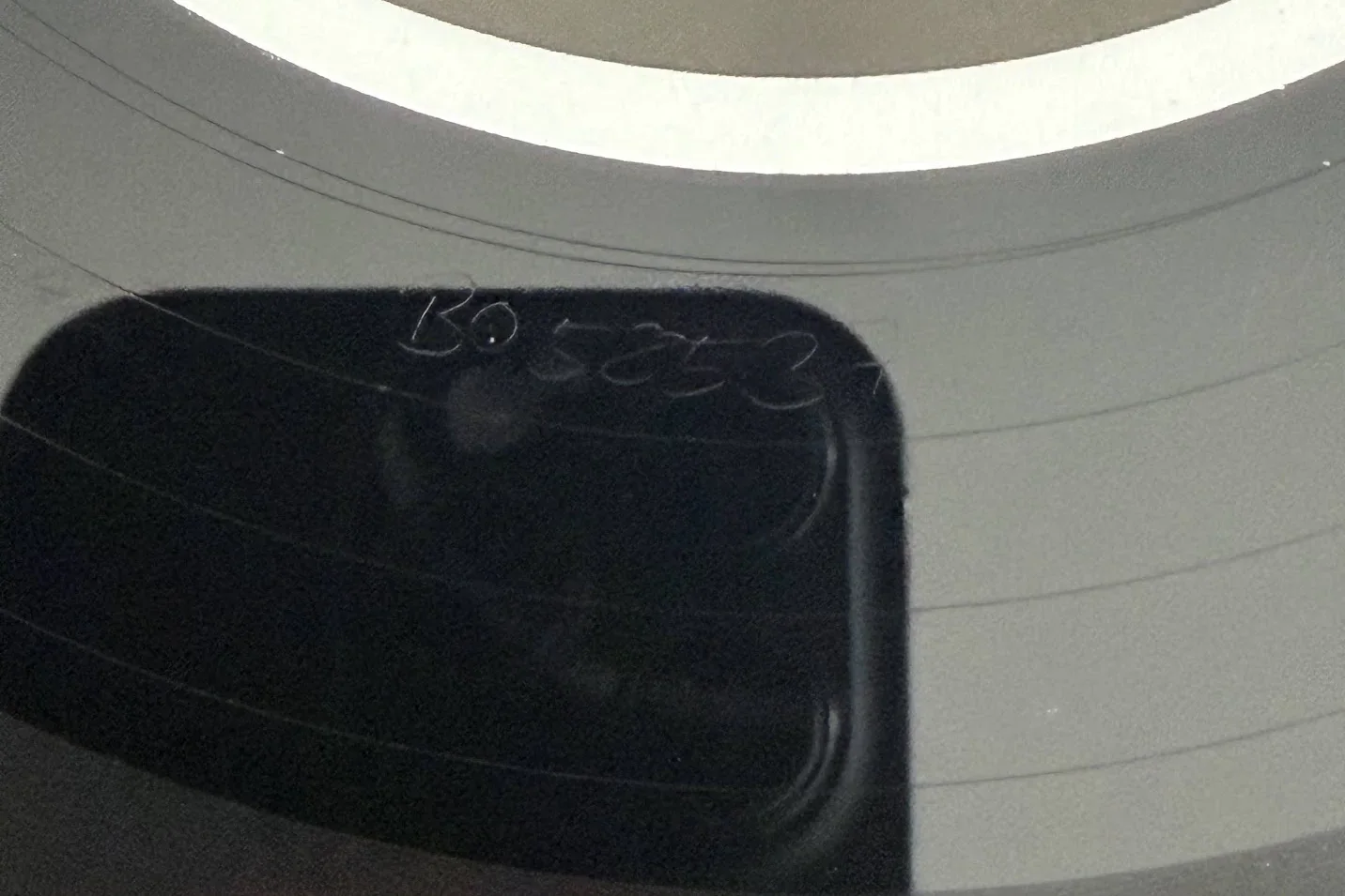 A close look at the etched runout beside a record label
