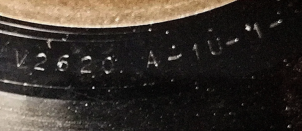 Stamped runout characters on a record